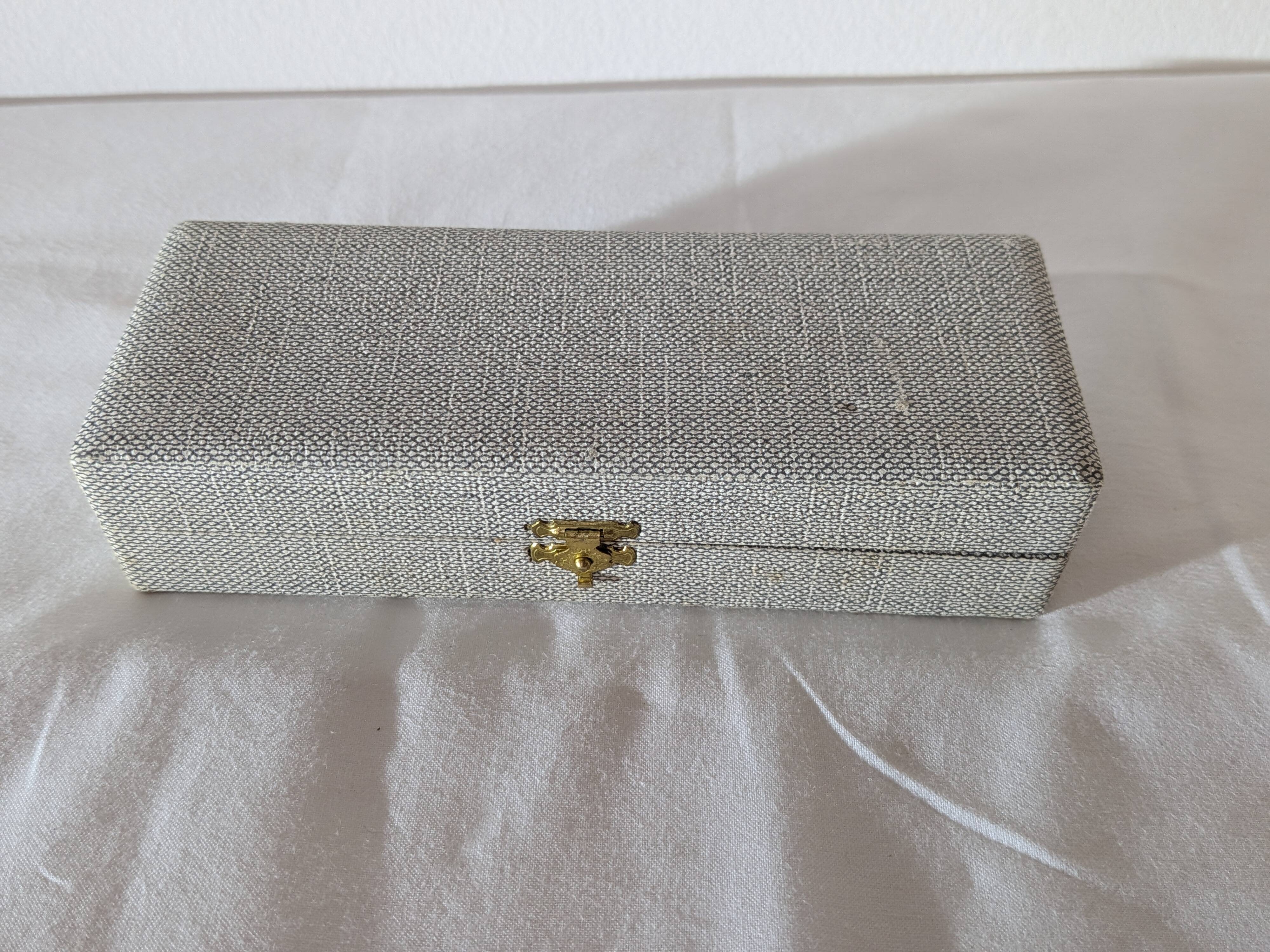 Vintage gold sugar tongs with case