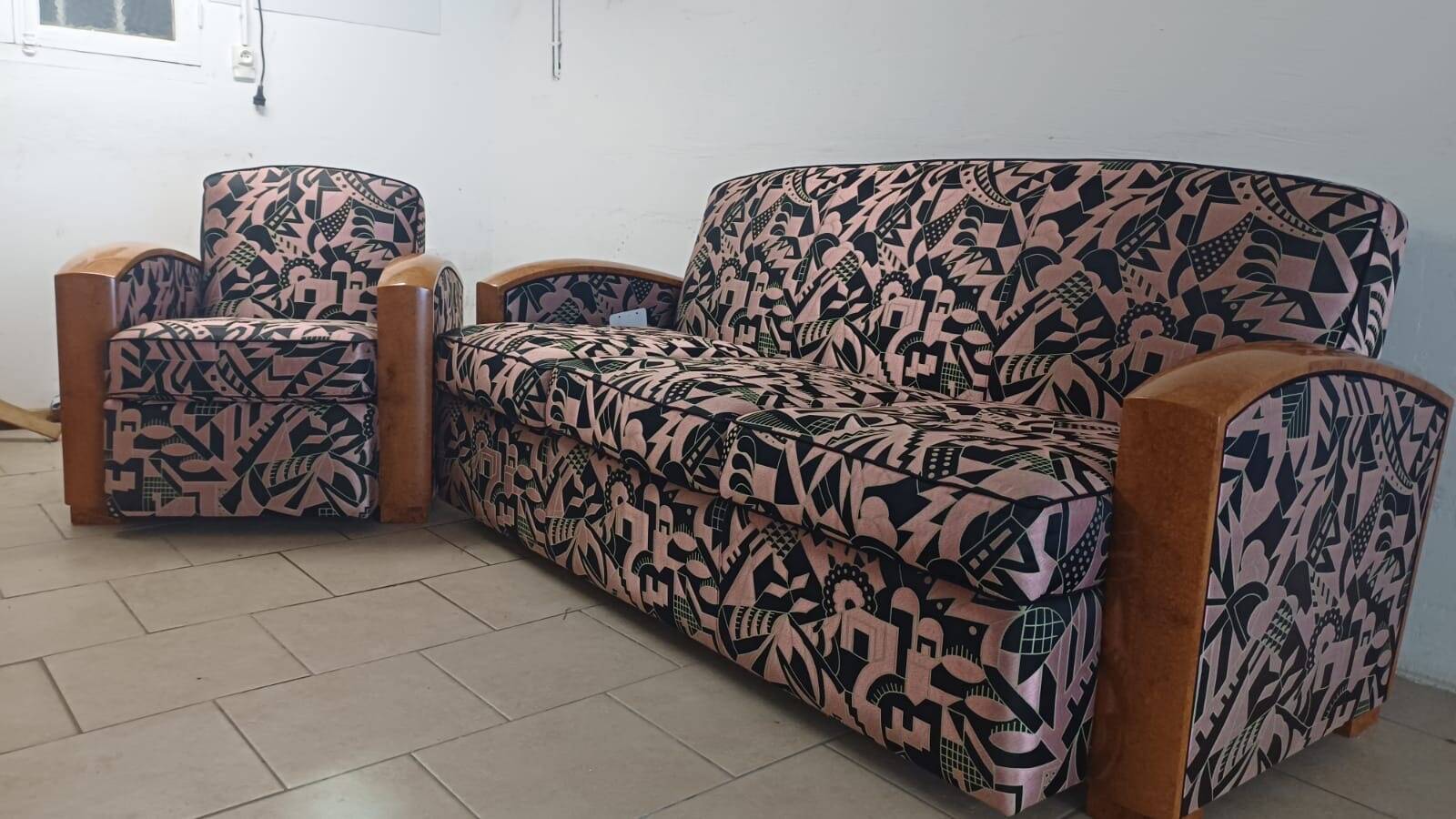 Convertible sofa and art deco armchair in lelievre fabrics.