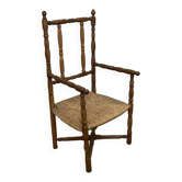 Straw and turned wood armchair
