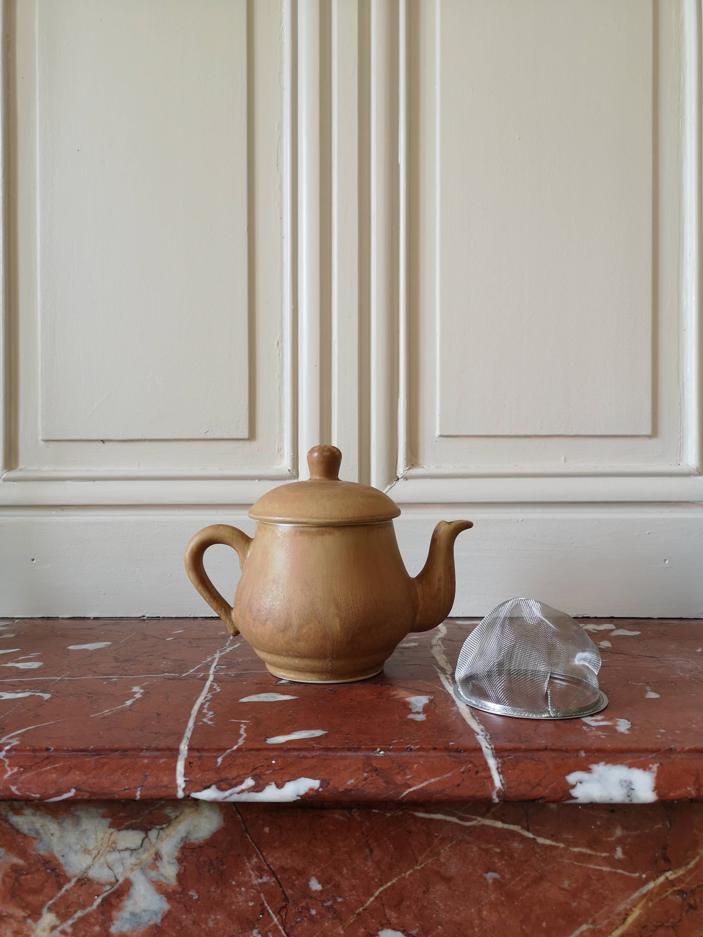 Vintage stoneware teapot and cup, "selfish" tea service, signed
