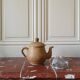 Vintage stoneware teapot and cup, "selfish" tea service, signed