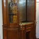 Empire style half-moon shaped mahogany bookcase with putti