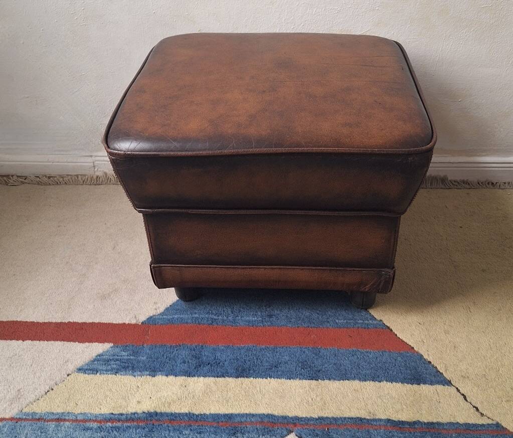 Vintage ottoman / pouffe in chestnut brown leather