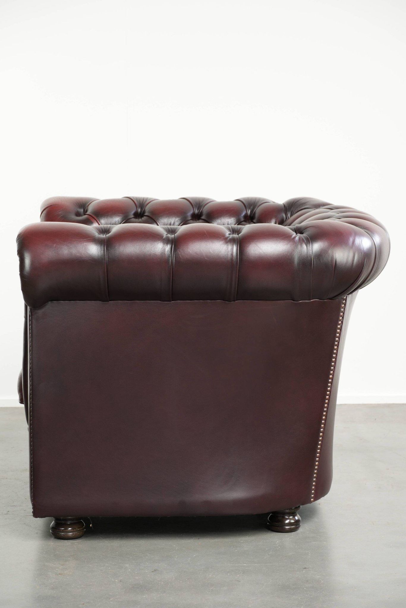 English cowhide Chesterfield club armchair in a beautiful red colour