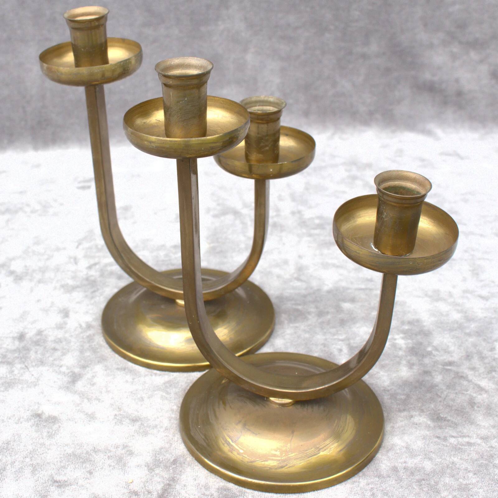 A beautiful pair of antique French Art Deco brass candlesticks