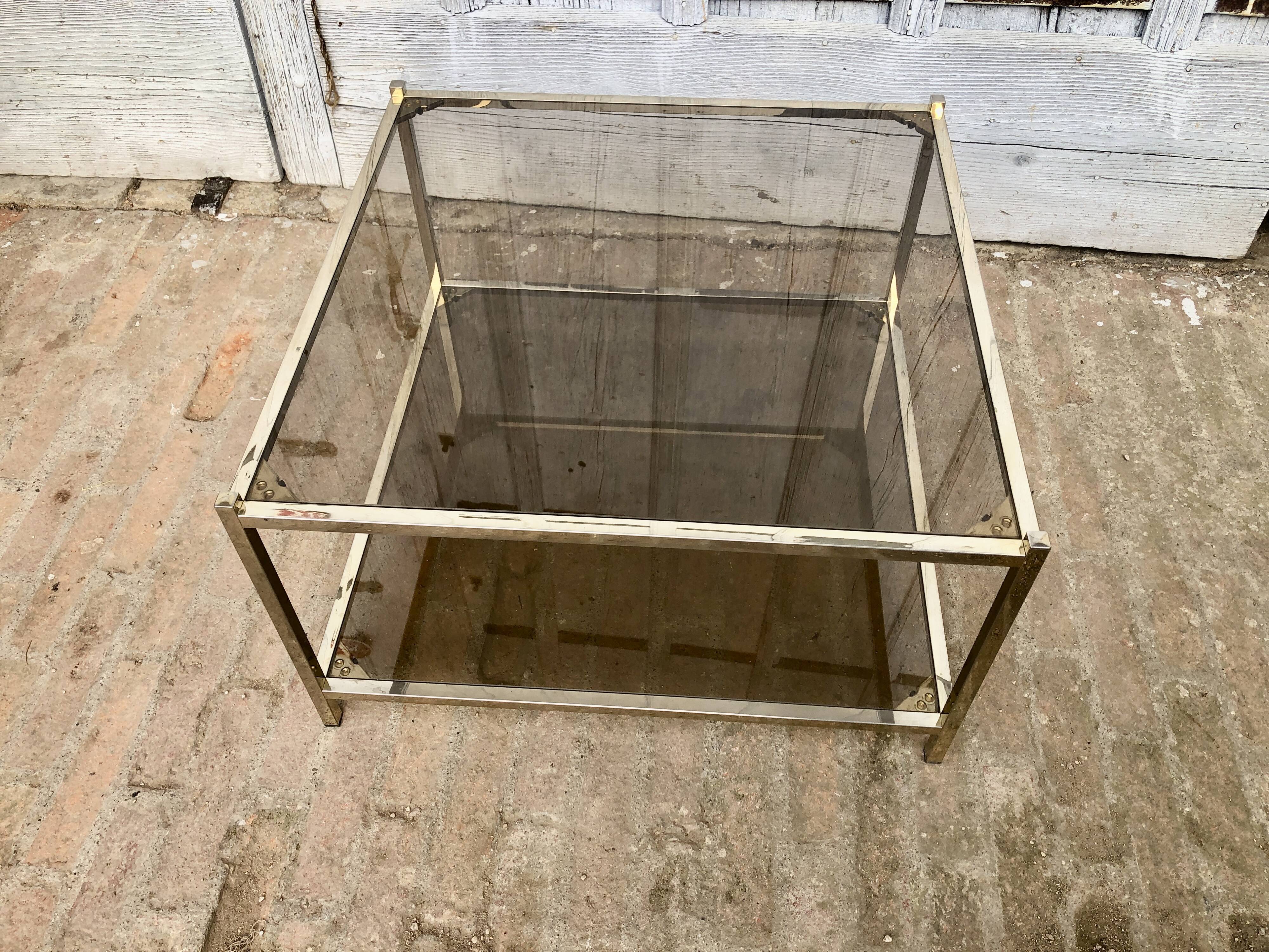 Square brass coffee table and smoked glasses