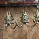set of 5 antique gold metal hooks