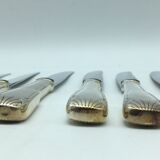 12 silver metal knives.