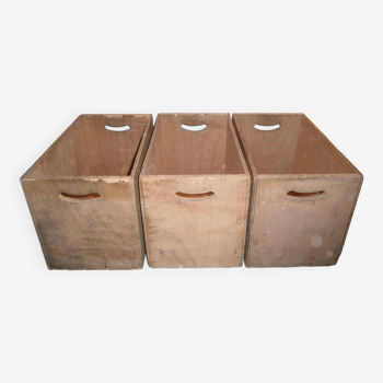 3 identical wooden boxes with handles
