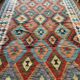 Oriental kilim rug afghan colored red and multicolored