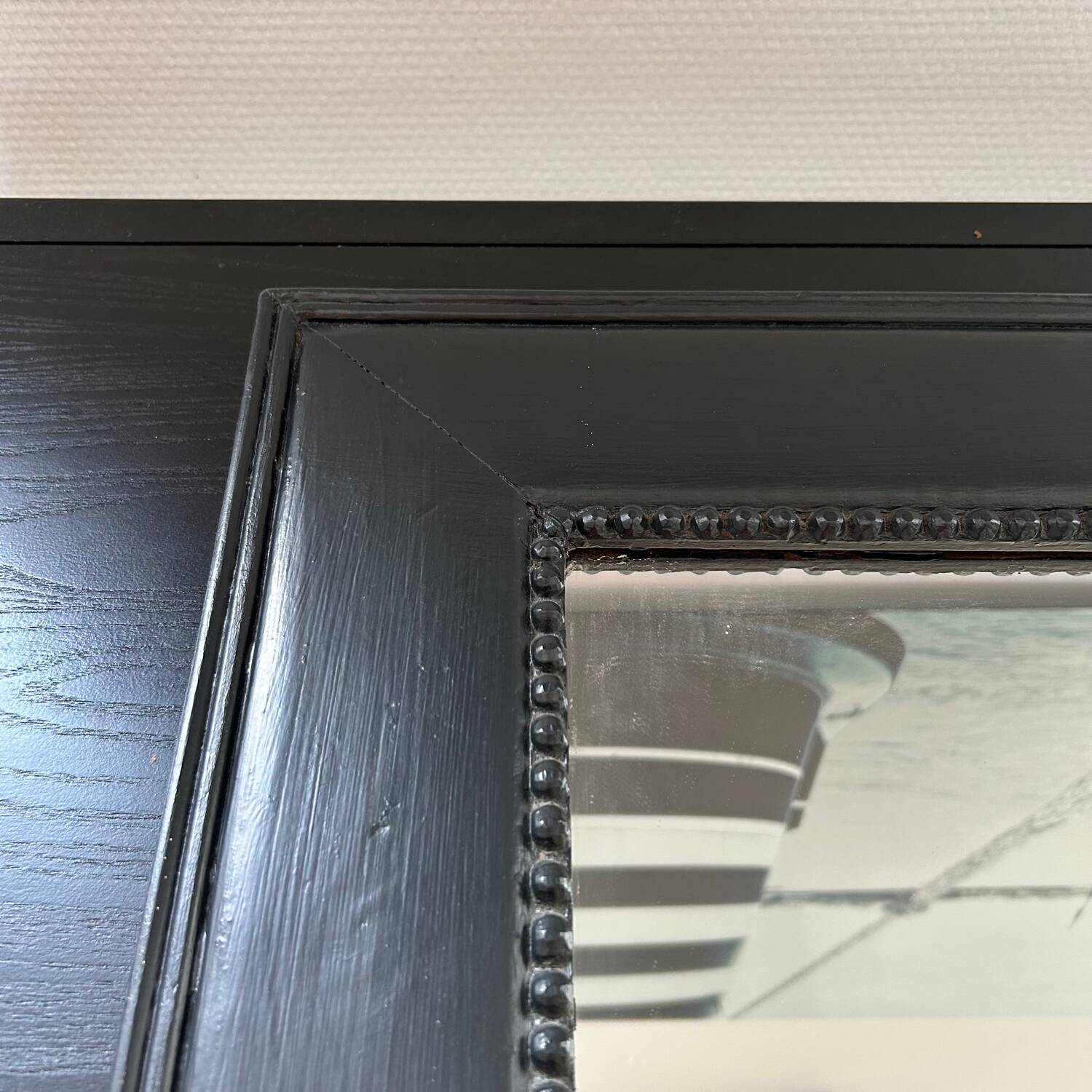 Pearled black frame mirror