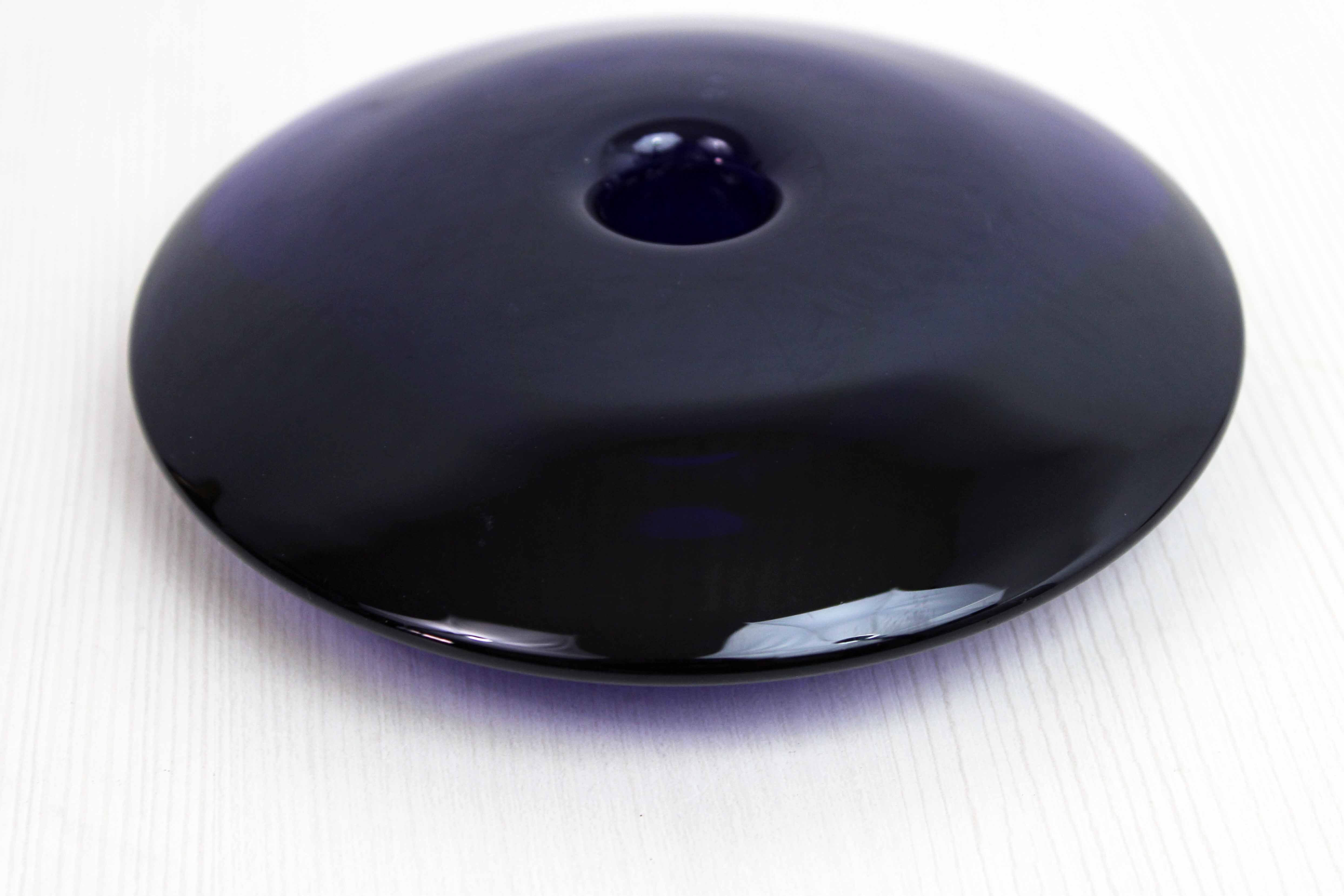 Blue glass saucer candle holder