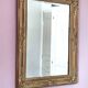 Richly carved antique gilded mirror