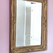 Miroir ancien doré richement sculpté