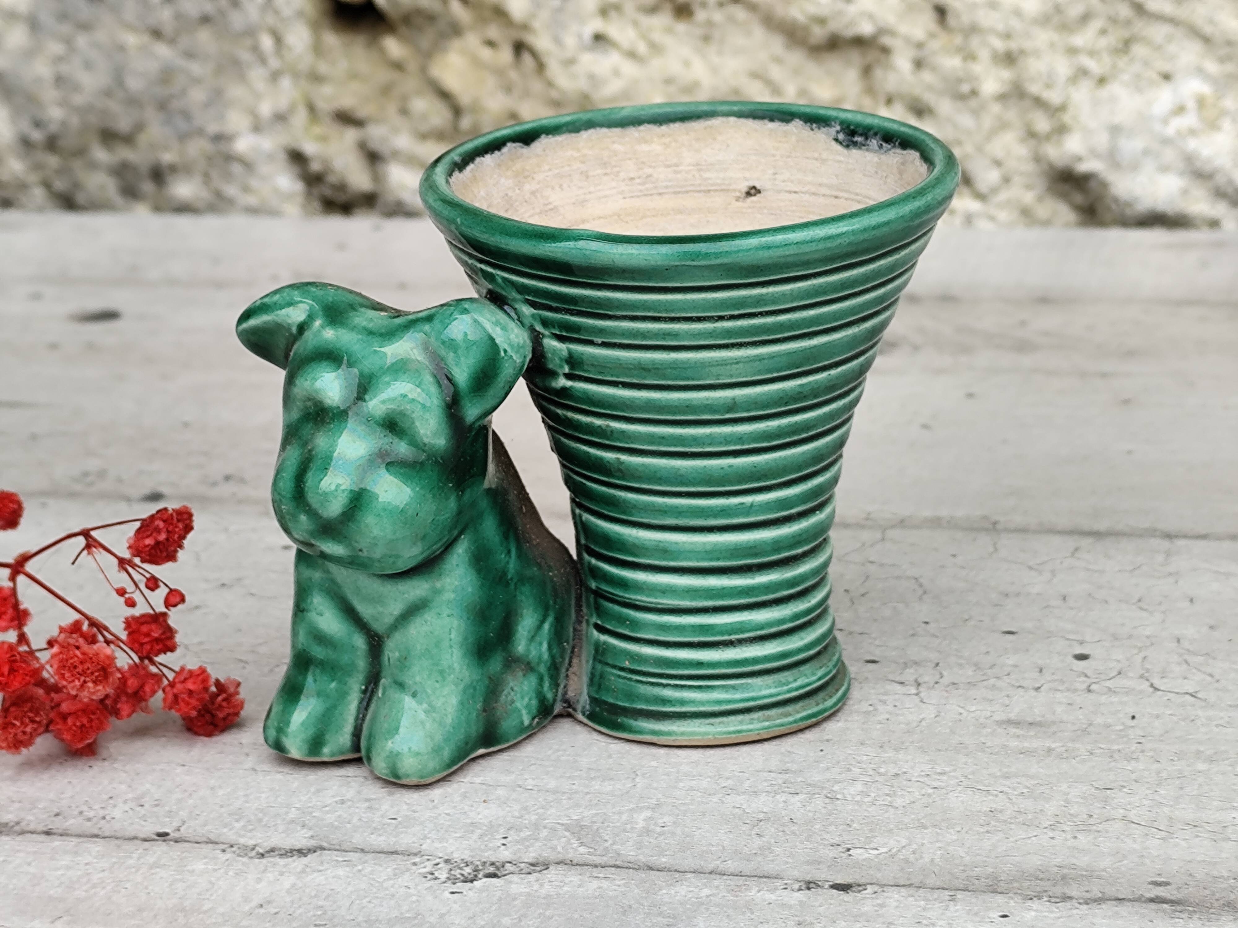 Green ceramic empty pocket dog statue