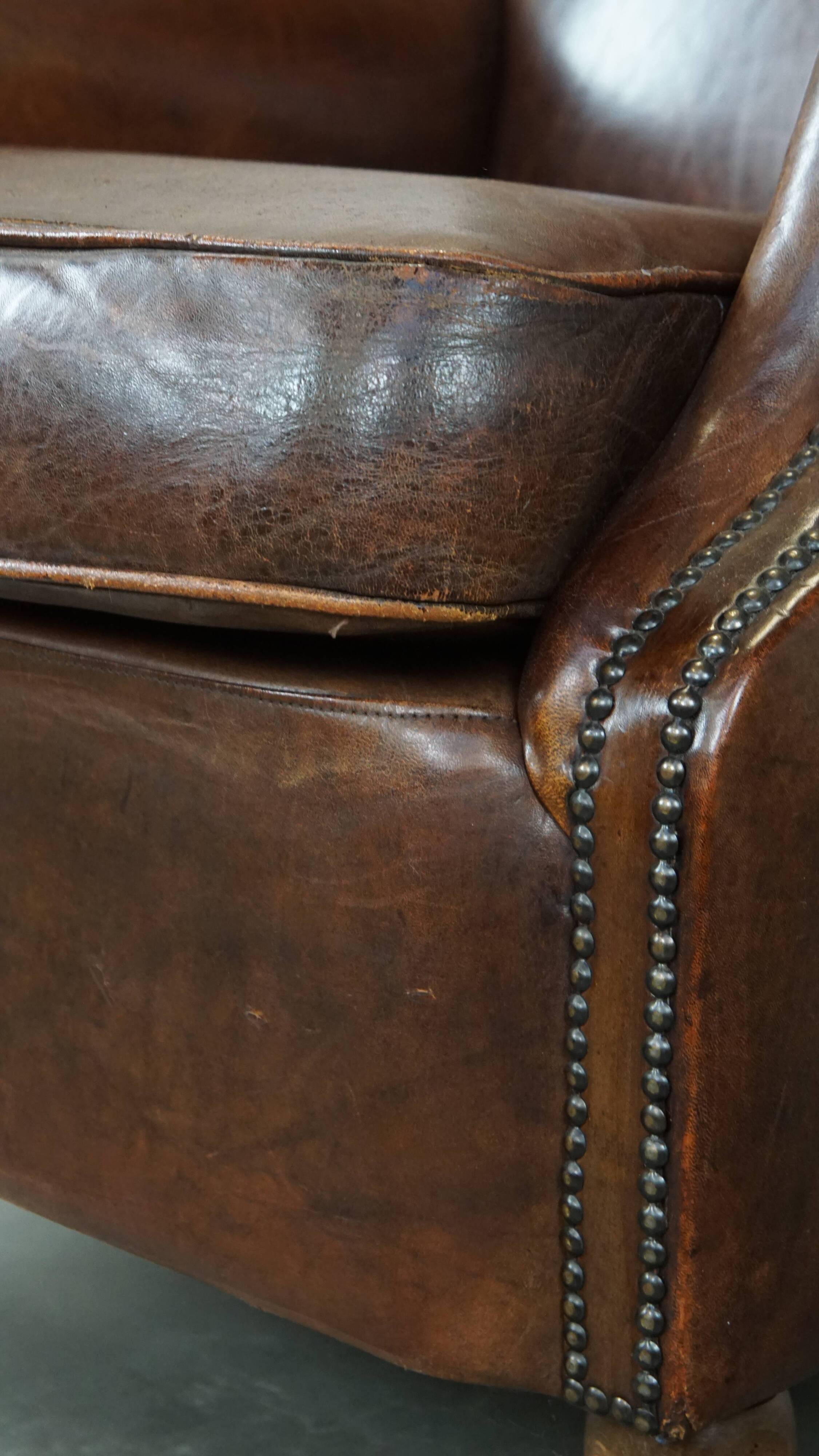 Sheep leather armchair on wheels