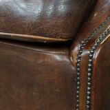 Sheep leather armchair on wheels