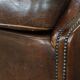 Sheep leather armchair on wheels