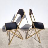 Pair of black and gold folding opera chairs