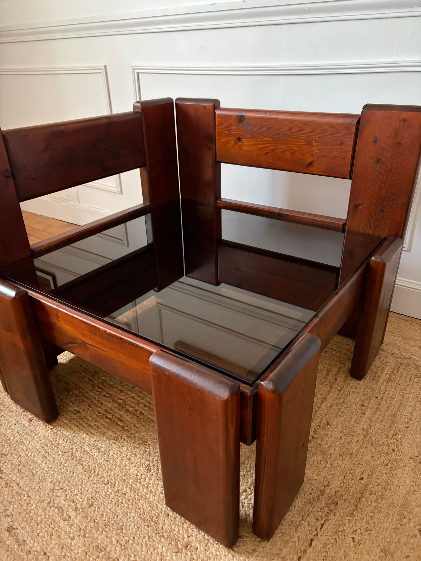 Modernist coffee table in wood and smoked glass.