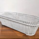 White perforated sheet metal planter by Mathieu Mategot