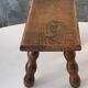 Footstool in varnished wood turns old