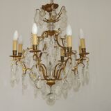 French Louis XV chandelier with 8 lights in gilded bronze, glass and crystal.