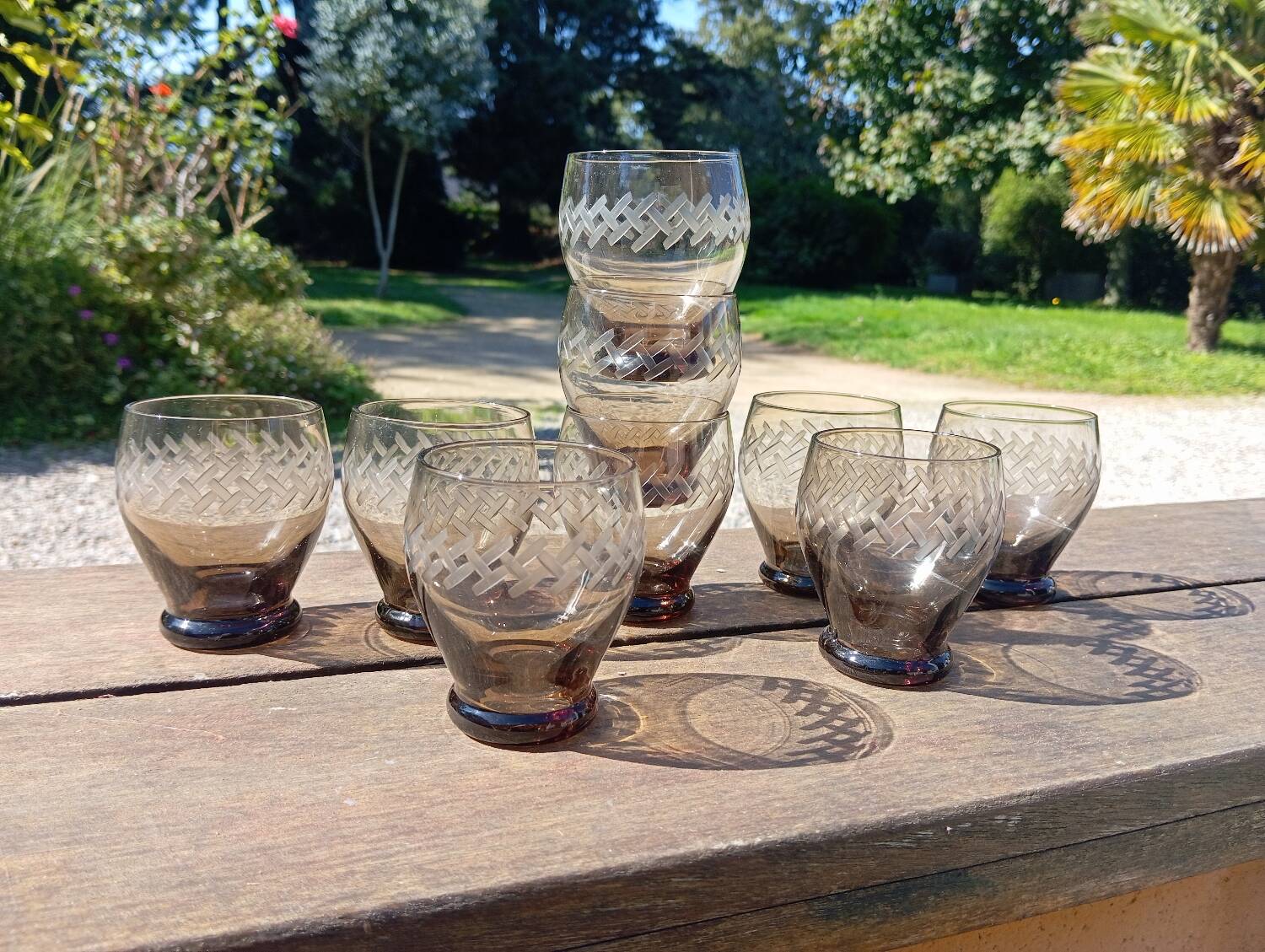 Set of 9 digestive glasses, smoked glass cut in art deco style