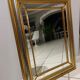 Mirror in gold and silver color
