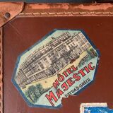 Old travel suitcase and legendary stickers, 1920