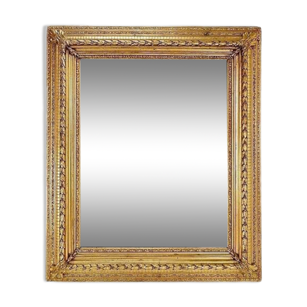 Large gilded wood and stucco mirror with foliage