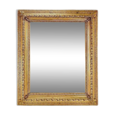 Large gilded wood and stucco mirror with foliage