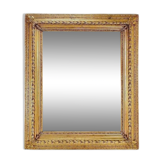 Large gilded wood and stucco mirror with foliage