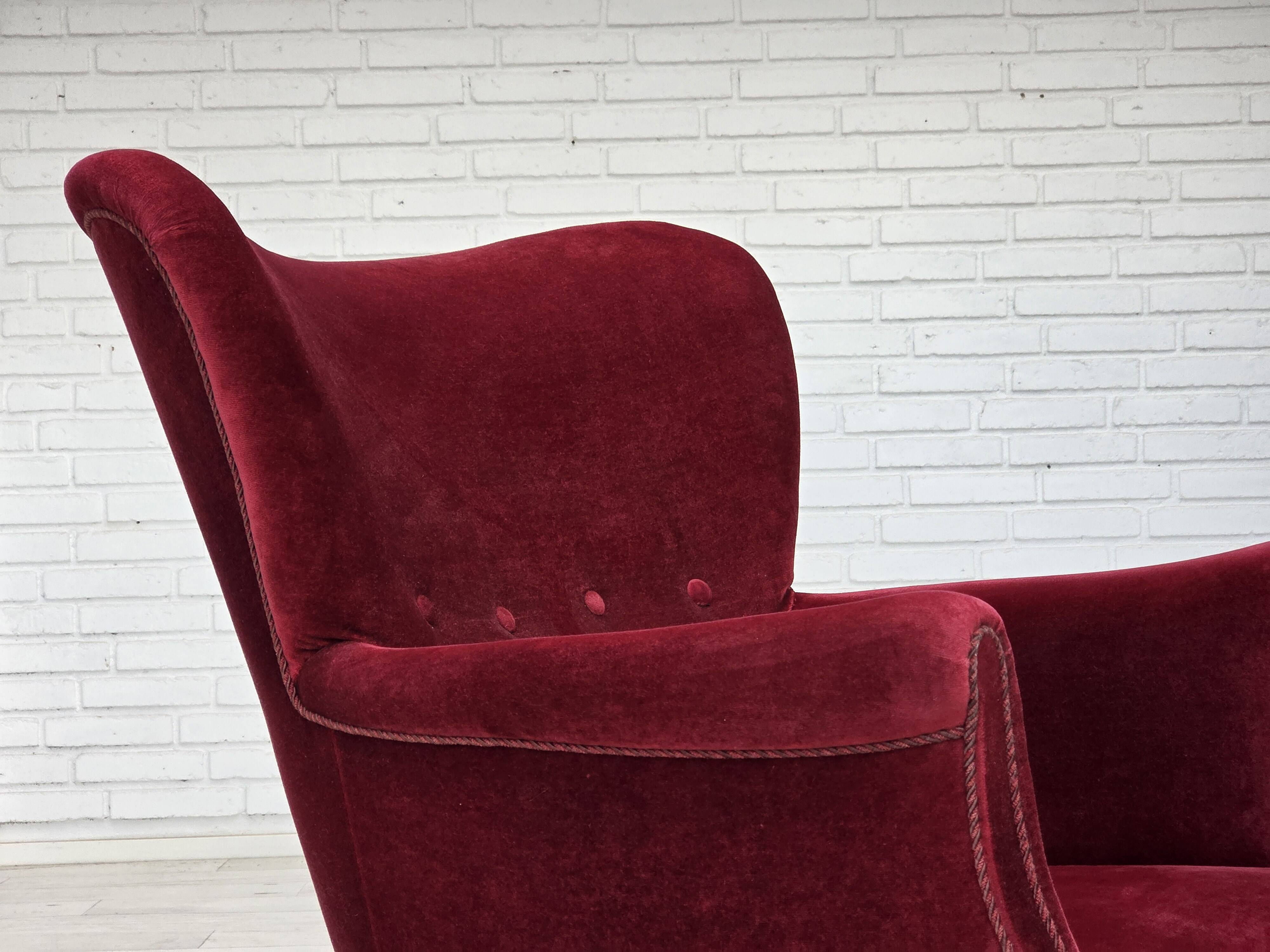 1970s, Danish armchair, cherry-red furniture velour, oak wood legs.