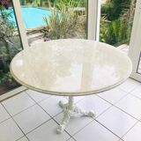 Round marble table with central cast iron leg