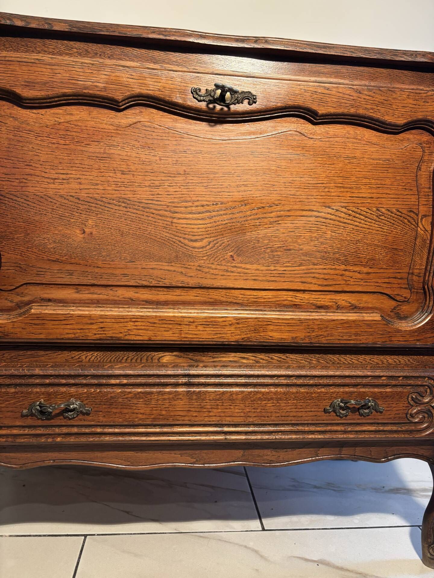 Louis XV style oak TV cabinet with drop-down flap.