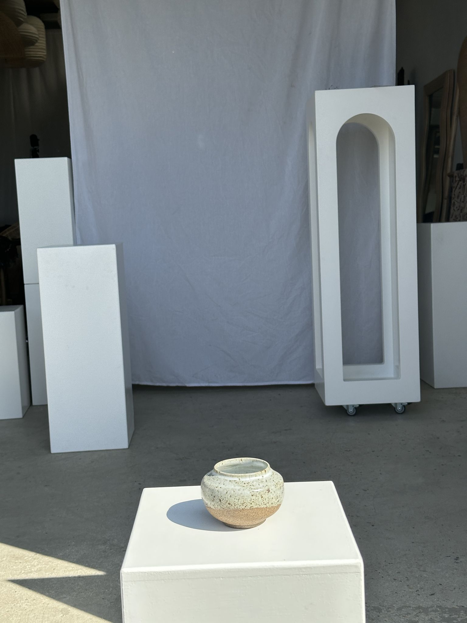 Small white ball vase tight neck in glazed speckled ceramic