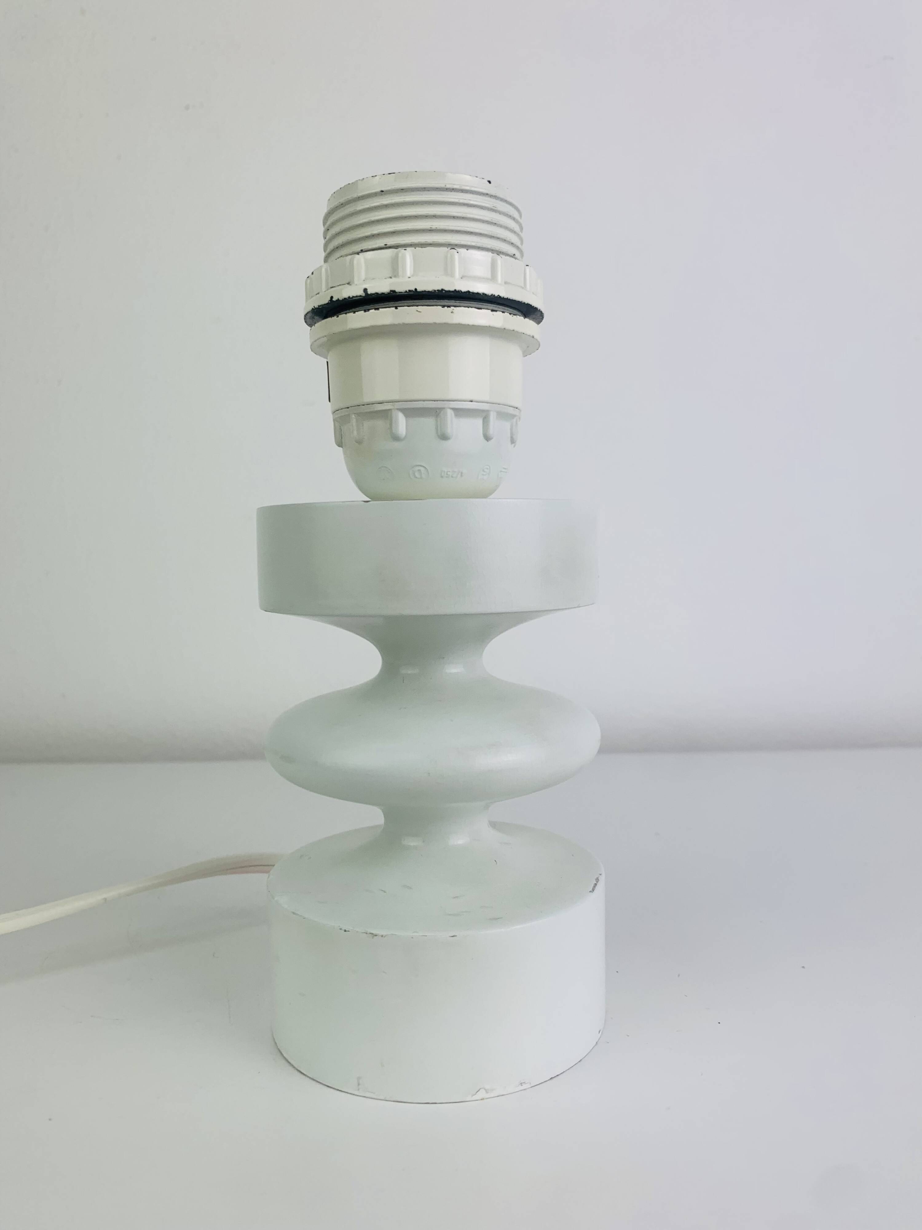 Temde lamp with turned wood and a seventies lampshade.