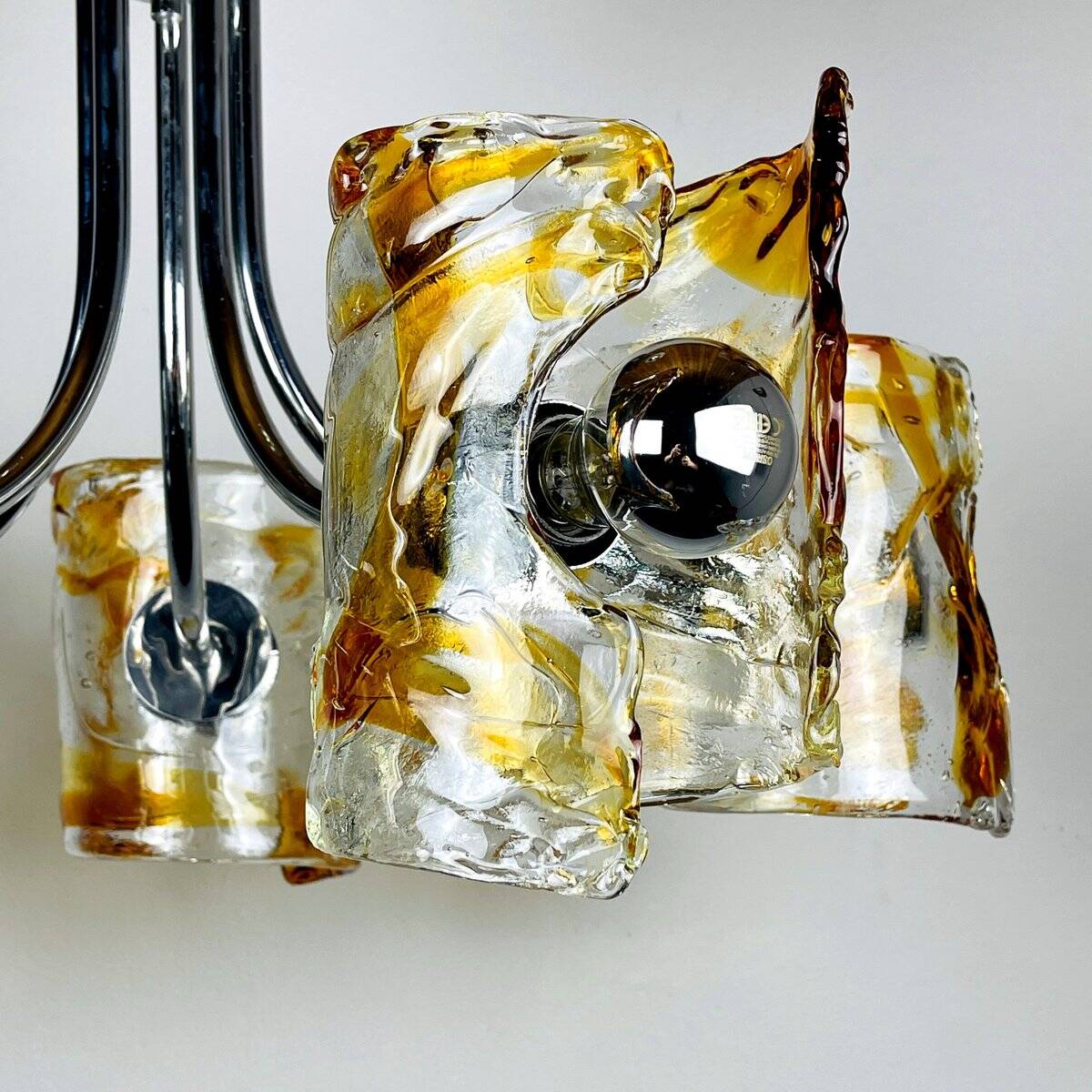 Mid-century chandelier in amber Murano and chrome by Toni Zuccheri for Mazzega, Italy, 1970s.