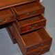 Partner desk with double pedestal in burr yew wood with decorated top.