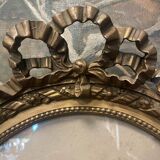 Old ancestor portrait in a gilded oval frame with Louis XVI style knot decoration