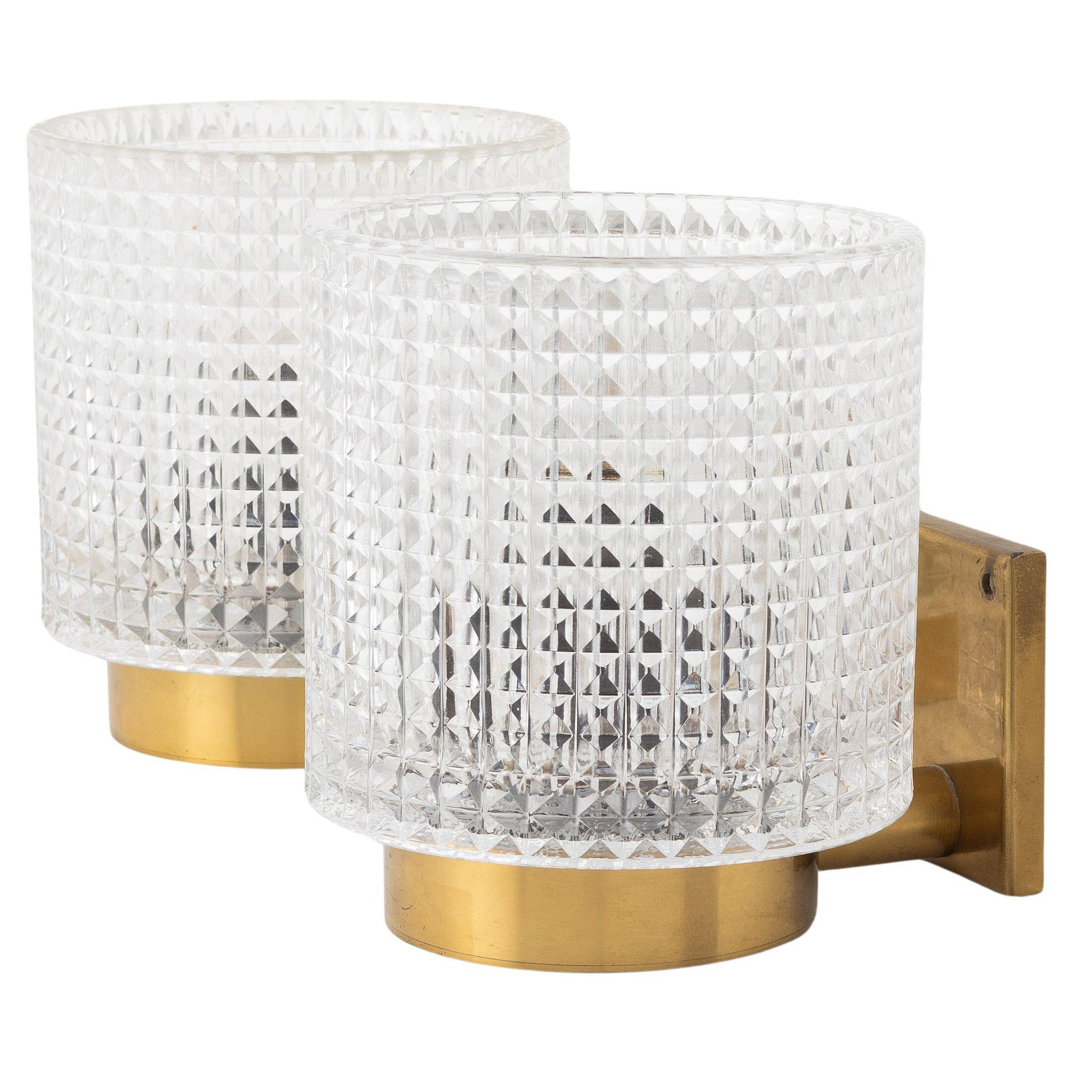 Carl Fagerlund for Orrefors Pair of wall lights in brass and glass Sweden 1960