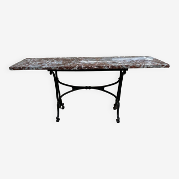 Old cast iron and red marble bistro table