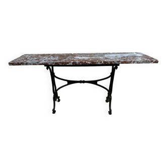 Old cast iron and red marble bistro table