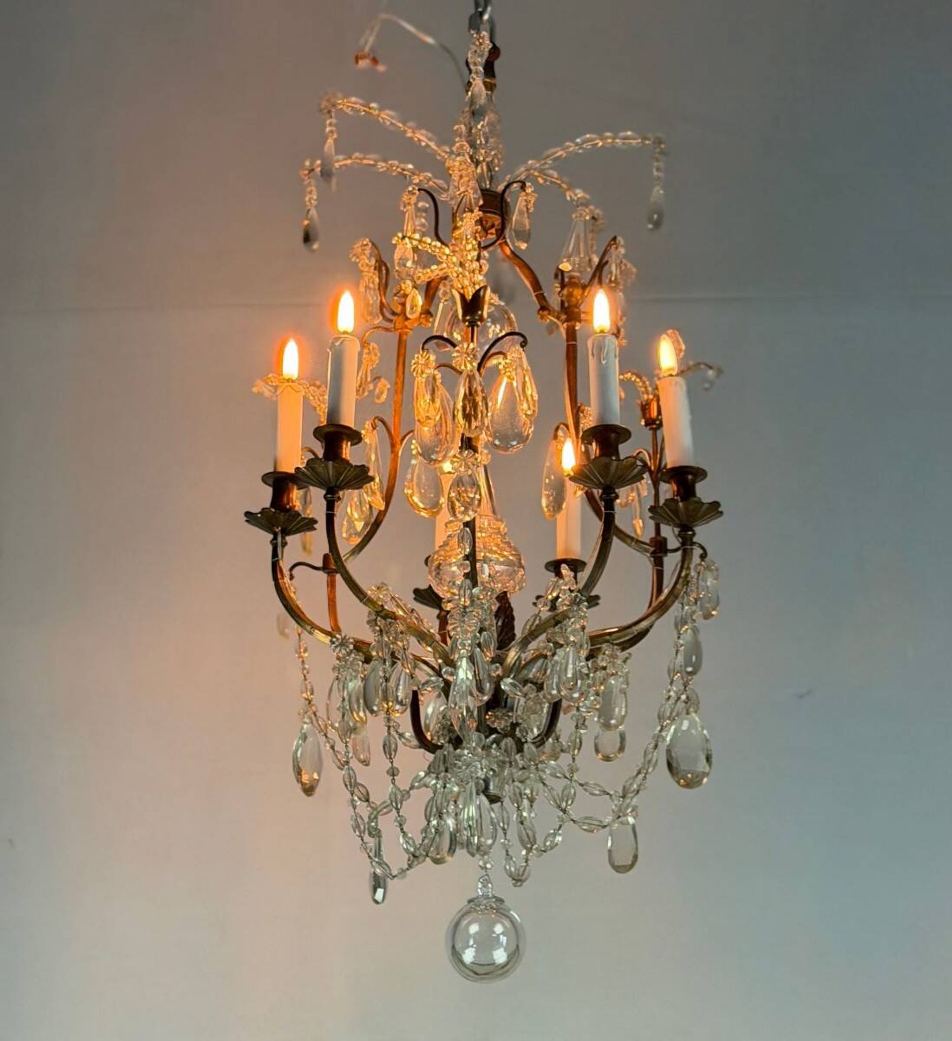 Bronze cage chandelier adorned with crystal drops, circa 1880