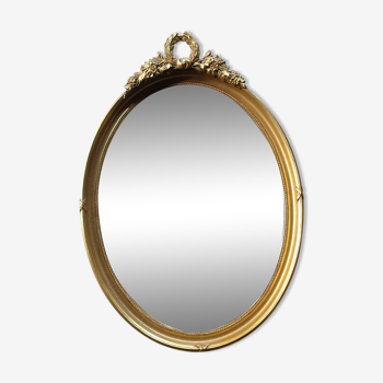 Golden oval mirror 34x50cm