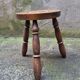 Turned wooden tripod stool