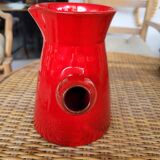 Ancient pitcher in red enamelled sandstone