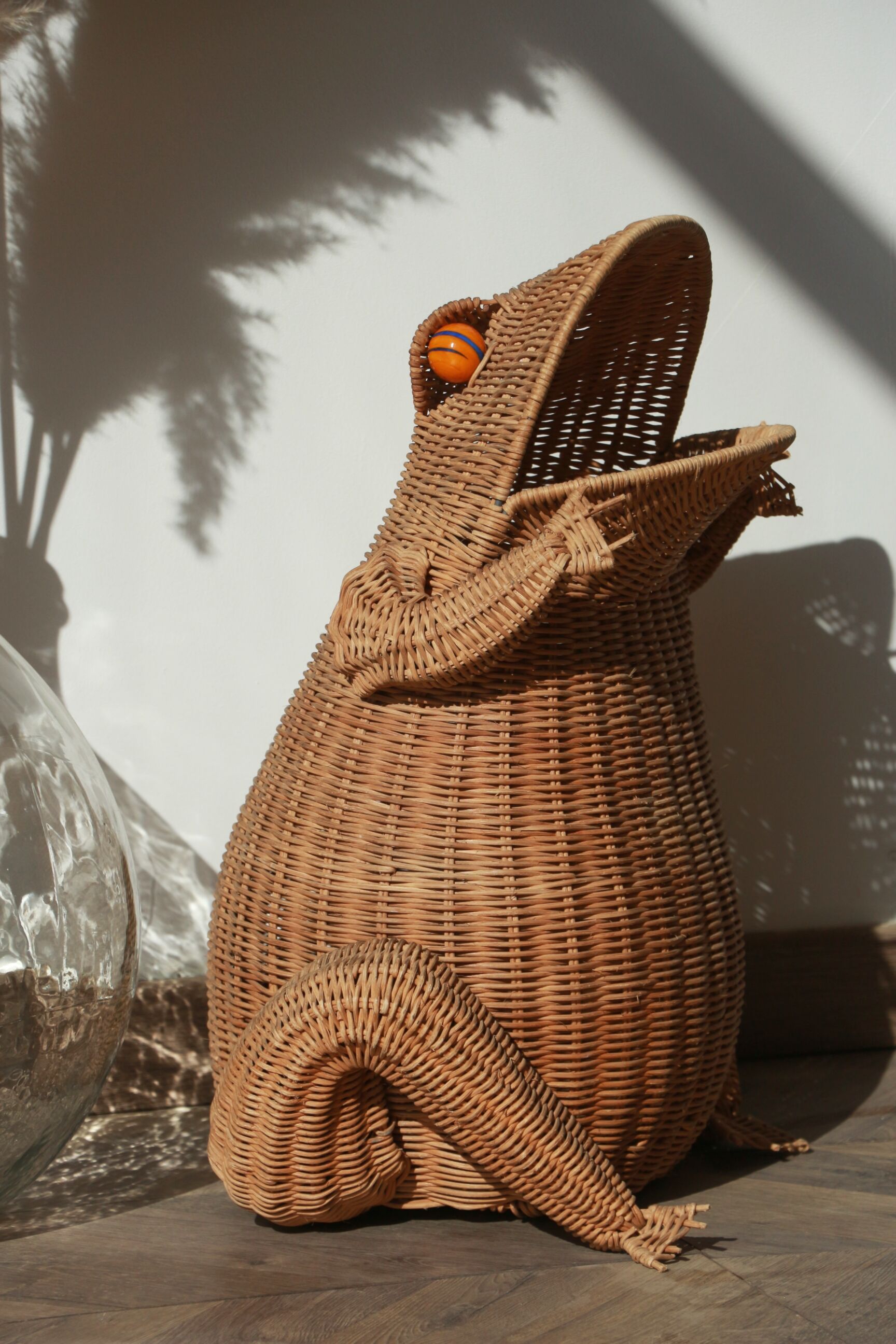 Wicker frog magazine rack by Olivier Cajan