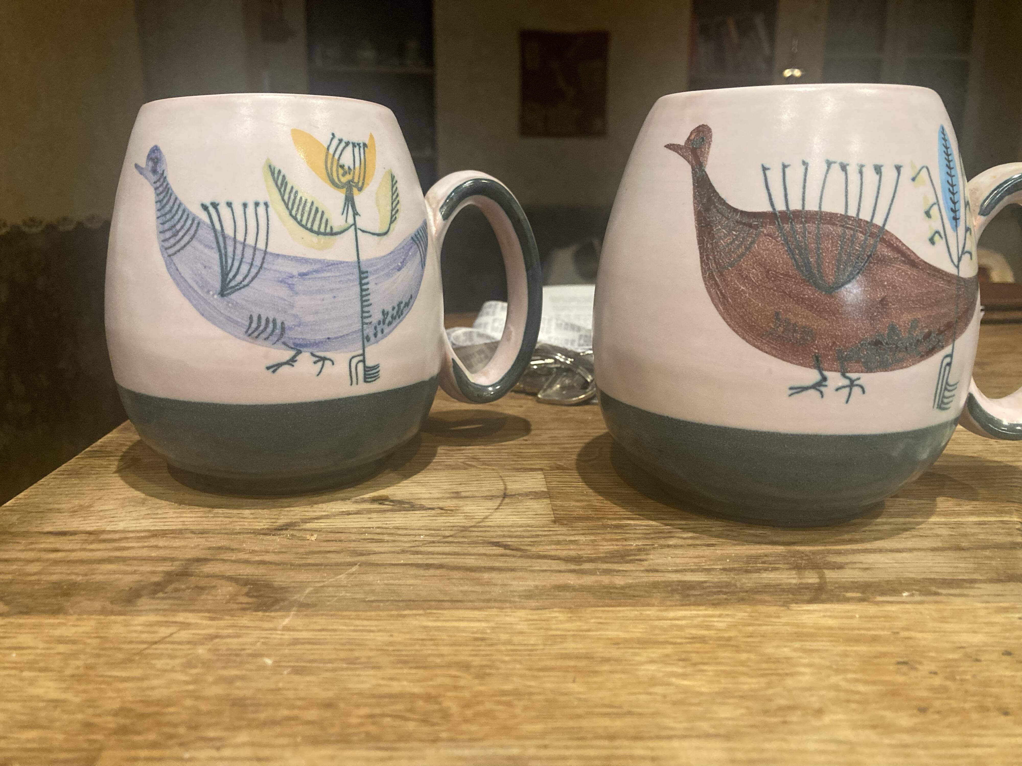 Set of two ceramic mugs signed Yvon ROY